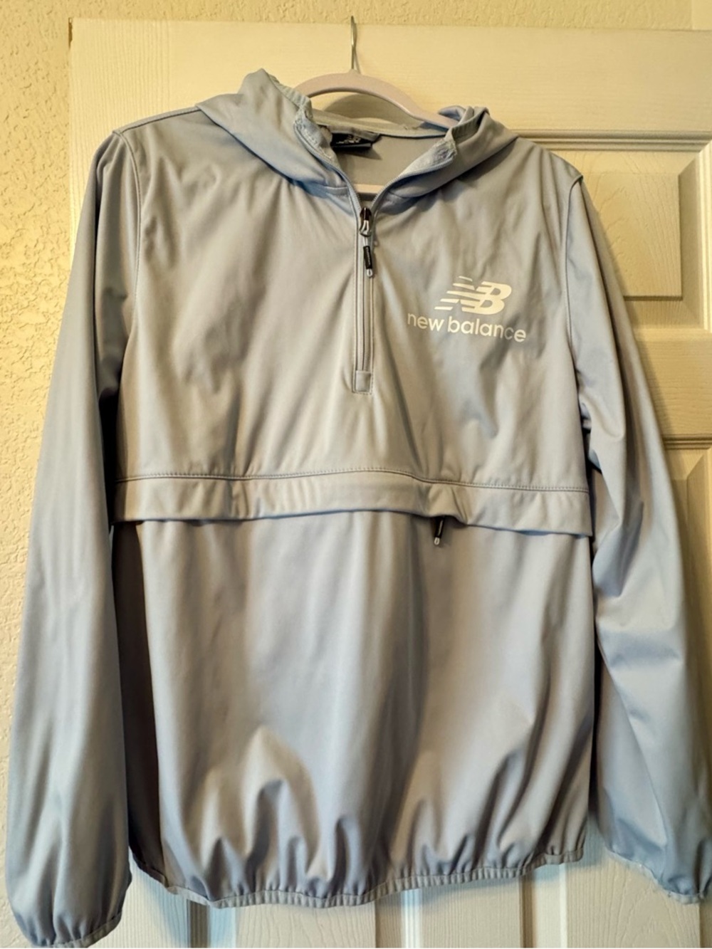 New Balance Pale Blue Hooded Jacket with Zipper Pouch/thumb holes